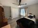 Bedroom with ceiling fan, closet, and window, creating a cozy and functional space at 140 Puckett Creek Dr, Canton, GA 30114