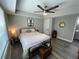 Spacious bedroom with neutral walls, a ceiling fan, and a comfortable-looking bed at 140 Puckett Creek Dr, Canton, GA 30114