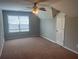 Bonus room featuring natural light, plush carpet, and a ceiling fan at 140 Puckett Creek Dr, Canton, GA 30114