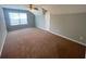 Spacious bonus room with plush carpet, natural light, and ample space at 140 Puckett Creek Dr, Canton, GA 30114