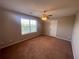 Well-lit bonus room with carpet, ceiling fan and window at 140 Puckett Creek Dr, Canton, GA 30114