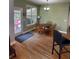 Sunny dining area with wood floors, a round table, and natural lighting from the window at 140 Puckett Creek Dr, Canton, GA 30114
