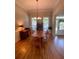 Spacious dining room with hardwood floors and large windows, perfect for Gathering gatherings at 140 Puckett Creek Dr, Canton, GA 30114