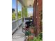 Cozy front porch with brick columns and rocking chairs; perfect for relaxing outdoors at 140 Puckett Creek Dr, Canton, GA 30114