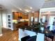 Bright kitchen with hardwood floors, wooden cabinets, and an island with barstool seating at 140 Puckett Creek Dr, Canton, GA 30114