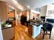 Modern kitchen with granite countertops and an island that opens to the living room at 140 Puckett Creek Dr, Canton, GA 30114