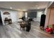 Spacious living area with gray flooring, a large tv screen and neutral walls at 140 Puckett Creek Dr, Canton, GA 30114