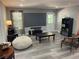 Living area with large movie screen, neutral color scheme, and plenty of natural light at 140 Puckett Creek Dr, Canton, GA 30114