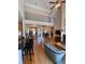 Open-concept living area featuring hardwood floors and a wrought iron staircase at 140 Puckett Creek Dr, Canton, GA 30114