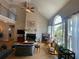 Cozy living room with a fireplace, large windows, and ample natural light at 140 Puckett Creek Dr, Canton, GA 30114