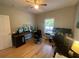 Home office featuring hardwood floors and natural light, perfect for a productive workspace at 140 Puckett Creek Dr, Canton, GA 30114