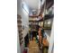 Walk-in pantry with custom wood shelving, ample space for dry food and canned goods, and built-in lighting at 140 Puckett Creek Dr, Canton, GA 30114