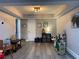 Inviting playroom with wood-look floors and ample space for play and storage at 140 Puckett Creek Dr, Canton, GA 30114