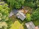 Aerial view of home with a gazebo, mature trees, spacious backyard, and long driveway at 1759 Kimberly Sw Dr, Marietta, GA 30008