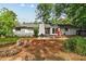 Cozy backyard with a fire pit, patio, grill, and view of the home's back exterior at 1759 Kimberly Sw Dr, Marietta, GA 30008