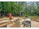 Backyard patio featuring a grill, outdoor seating, and storage, with a punching bag at 1759 Kimberly Sw Dr, Marietta, GA 30008