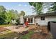 Backyard patio featuring outdoor seating and a grill, with an eye-catching punching bag for workouts at 1759 Kimberly Sw Dr, Marietta, GA 30008
