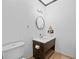 Simple bathroom with white toilet, neutral walls and a single sink at 1759 Kimberly Sw Dr, Marietta, GA 30008