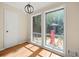 Sunlit breakfast nook featuring views to backyard, modern pendant lighting and door to hall at 1759 Kimberly Sw Dr, Marietta, GA 30008