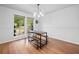 Bright and airy dining room with large windows and an elegant chandelier at 1759 Kimberly Sw Dr, Marietta, GA 30008