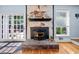 Cozy living room fireplace with stone hearth and outdoor access at 1759 Kimberly Sw Dr, Marietta, GA 30008