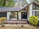 Inviting front entryway with a charming porch, decorative plants, and a well-maintained lawn at 1759 Kimberly Sw Dr, Marietta, GA 30008