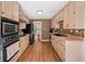 Spacious kitchen featuring wooden cabinets, modern appliances, and an opening to the breakfast area at 1759 Kimberly Sw Dr, Marietta, GA 30008