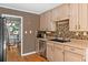Cozy kitchen with wooden cabinets, stainless steel appliances, and a mosaic backsplash at 1759 Kimberly Sw Dr, Marietta, GA 30008