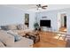 Spacious living room with hardwood floors, ceiling fan and comfortable seating, ideal for relaxation and entertainment at 1759 Kimberly Sw Dr, Marietta, GA 30008
