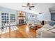 Bright living room boasts hardwood floors, a stone fireplace, and lots of natural light at 1759 Kimberly Sw Dr, Marietta, GA 30008
