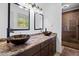 Main bathroom featuring double bowl sinks, granite counters and tiled shower at 1759 Kimberly Sw Dr, Marietta, GA 30008
