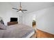 Comfortable main bedroom with hardwood floors and an ensuite bathroom at 1759 Kimberly Sw Dr, Marietta, GA 30008