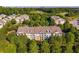Stunning aerial view of apartments surrounded by lush greenery, showcasing the community's serene setting and architecture at 1975 Nocturne Dr # 2303, Alpharetta, GA 30009