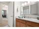 Bathroom featuring a granite countertop vanity, a large mirror, and contemporary lighting at 1975 Nocturne Dr # 2303, Alpharetta, GA 30009