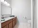 Bathroom features a granite countertop vanity and a neutral color palette at 1975 Nocturne Dr # 2303, Alpharetta, GA 30009
