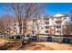 Apartment building with brick and siding, with a neatly landscaped parking area at 1975 Nocturne Dr # 2303, Alpharetta, GA 30009