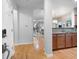 View of the foyer featuring hardwood floors and an open concept layout to the kitchen and living area at 1975 Nocturne Dr # 2303, Alpharetta, GA 30009
