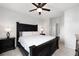 Comfortable main bedroom with a ceiling fan, dark wood furniture, and serene atmosphere at 1975 Nocturne Dr # 2303, Alpharetta, GA 30009