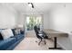 Well-lit office space featuring a comfortable sofa and functional work area at 1975 Nocturne Dr # 2303, Alpharetta, GA 30009
