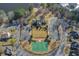 Aerial view of community featuring a basketball court, green space, and parking at 7933 Heathmore Dr, Fairburn, GA 30213