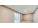 Neutral finished basement area with recessed lighting and access to other rooms at 7933 Heathmore Dr, Fairburn, GA 30213
