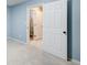 View into a full bathroom showing the tiled shower at 7933 Heathmore Dr, Fairburn, GA 30213