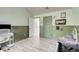 ' bedroom with color-blocked walls, light-colored floors, and fun wall décor at 7933 Heathmore Dr, Fairburn, GA 30213