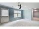 Bedroom featuring carpet, natural light, and an exterior door leading to the outside at 7933 Heathmore Dr, Fairburn, GA 30213