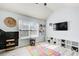 Playroom featuring chalkboard wall, colorful rug, and organizers at 7933 Heathmore Dr, Fairburn, GA 30213