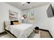 Cozy bedroom featuring a plush bed, modern decor, and a window for natural light at 7933 Heathmore Dr, Fairburn, GA 30213