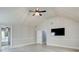 Spacious bedroom featuring a ceiling fan with light fixture and a television on the wall at 7933 Heathmore Dr, Fairburn, GA 30213