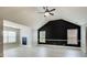 Bright bonus room featuring high ceilings, two windows and gray vinyl floors at 7933 Heathmore Dr, Fairburn, GA 30213