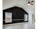 Bright bonus room featuring high ceilings, two windows and gray vinyl floors at 7933 Heathmore Dr, Fairburn, GA 30213