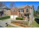 Beautiful two-story home with brick and siding, two-car garage and landscaped front yard at 7933 Heathmore Dr, Fairburn, GA 30213